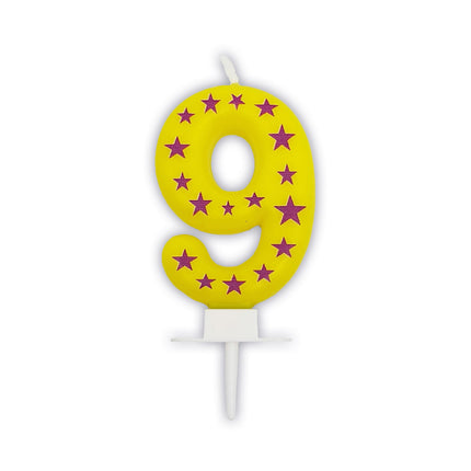 bougie de 9 ans jaune avec des étoiles