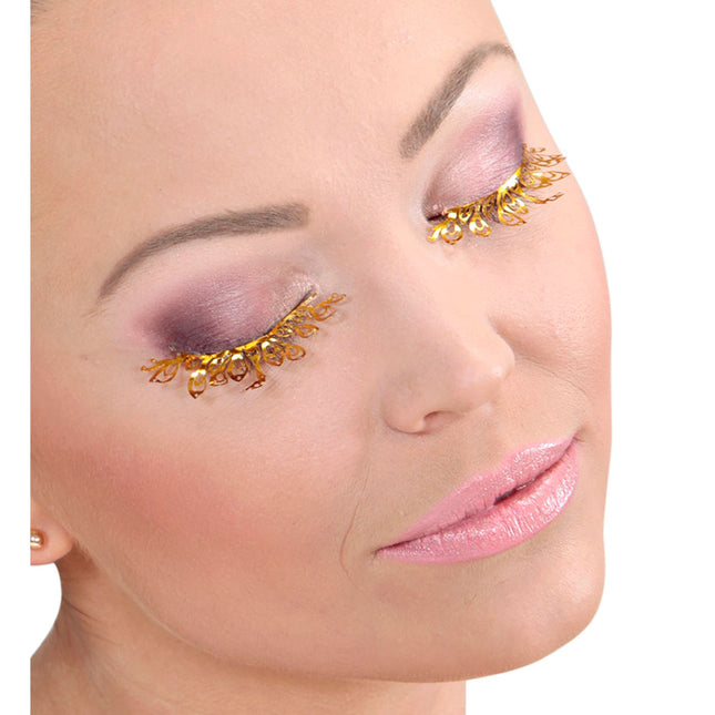 Faux cils dorés