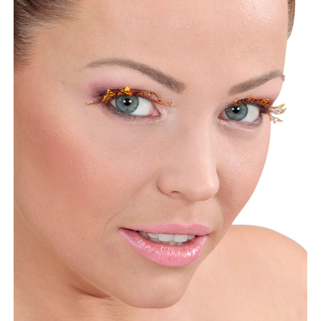 Faux cils dorés