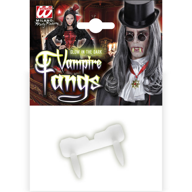 DENT DE VAMPIRE LUMINEUSE DANS L'OBSCURITÉ